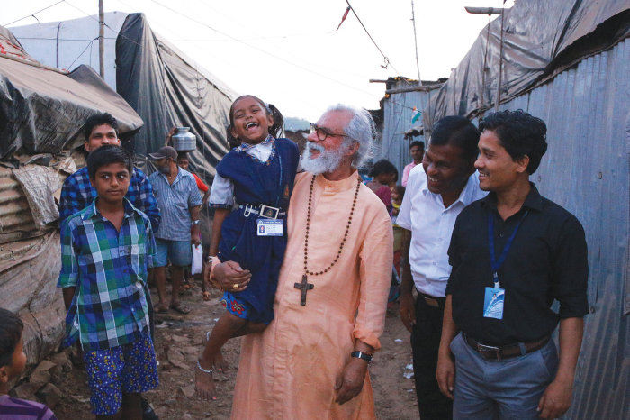 Gospel for Asia founder K.P. Yohannan greets people in Mumbai, India, in February 2018.