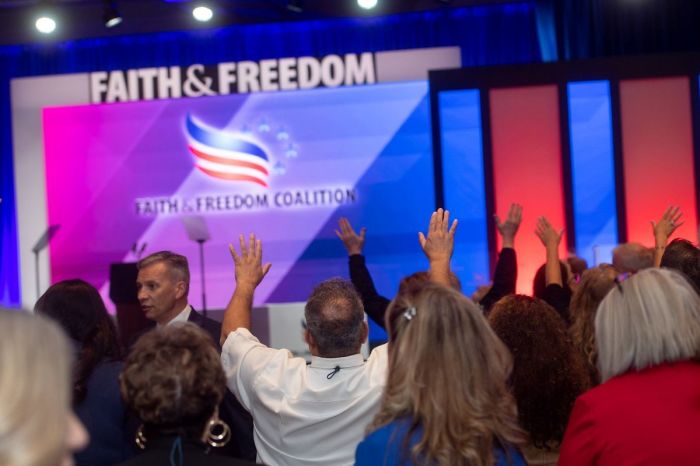 Attendees raise their hands in worship during the Faith & Freedom Coalition's 2020 Road to Majority Summit in Atlanta, Georgia on Sept. 30, 2020.
