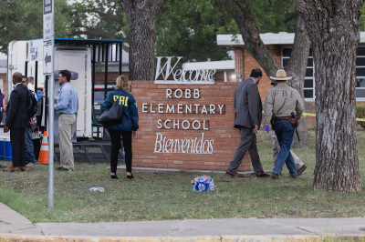 Law enforcement work the scene after a mass shooting at Robb Elementary School where 19 people, including 18 children, were killed on May 24, 2022, in Uvalde, Texas. The suspected gunman, identified as 18-year-old Salvador Ramos, was reportedly killed by law enforcement.