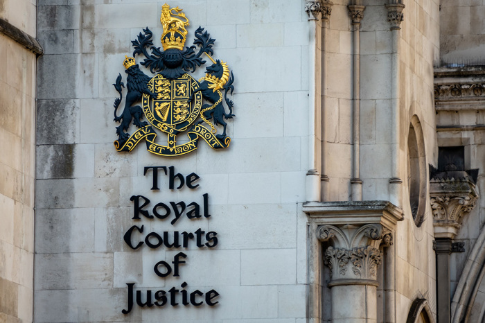Facade of the Royal Courts of Justice along the Strand in the City of Westminster in London, England.