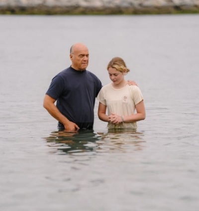 Greg Laurie, pastor and founder of Harvest Crusade and Harvest America, baptizing his granddaughter Stella at Pirate's Cove, California, on Saturday, July 8, 2023.