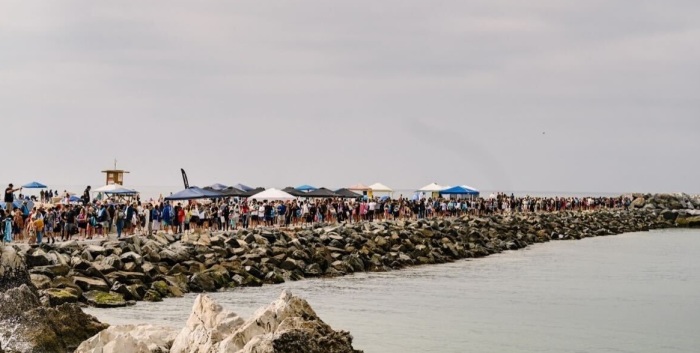 Thousands attend a mass baptism event at Pirate's Cove Beach, California, on Saturday, July 8, 2023. Known as the Jesus Revolution Baptism at Pirate’s Cove and overseen by Harvest Christian Fellowship Pastor Greg Laurie, the event reportedly saw around 4,500 people baptized.