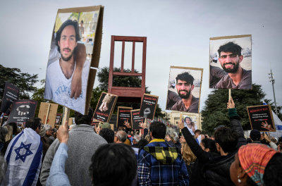 Supporters of Israel, members of the Jewish community and hostages' families and friends attend a rally calling for the release of hostages held by Hamas, next to a chair sculpture titled the 'Broken Chair,' near the United Nations office in Geneva, on October 22, 2023. Hamas militants in the Gaza Strip stormed Israel on October 7, taking more than 200 hostages and killing at least 1,400 people, according to Israeli officials.