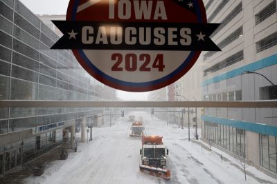 Plow trucks clear Grand Avenue as high winds and snow from winter storm Gerri four days before the Iowa caucuses on January 12, 2024 in Des Moines, Iowa. Republican presidential candidates postponed or cancelled many campaign events in Iowa days before the all-important caucuses, the first primary competition of the 2024 election year.