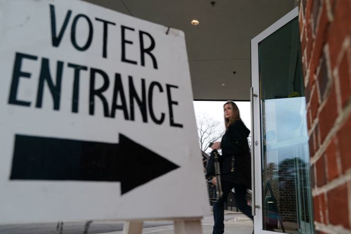 A voter leaves a polling place after casting their ballot.