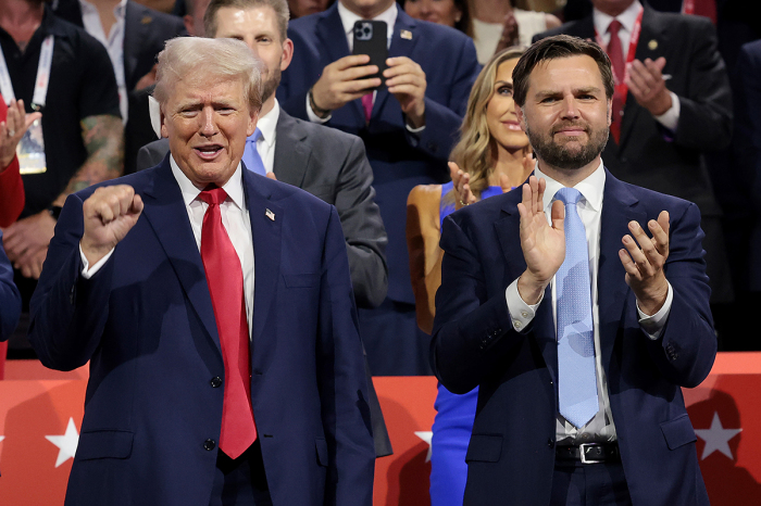 Republican presidential candidate, former U.S. President Donald Trump (L) and Republican vice presidential candidate, U.S. Sen. J.D. Vance, R-Ohio, appear on the first day of the Republican National Convention at the Fiserv Forum on July 15, 2024, in Milwaukee, Wisconsin. Delegates, politicians, and the Republican faithful are in Milwaukee for the annual convention, concluding with former President Donald Trump accepting his party's presidential nomination. The RNC takes place from July 15-18.