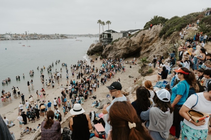 People are being baptized at the second annual Jesus Revolution Baptism at Pirate's Cove Beach in Corona Del Mar, California, on Saturday, July 27, 2024.