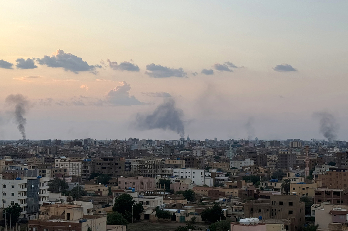Smoke billows during air strikes in central Khartoum as the Sudanese army attacks positions held by the paramilitary Rapid Support Forces (RSF) throughout the Sudanese capital on Oct. 12, 2024. Fierce fighting has raged since Oct. 11 around Khartoum, much of which is controlled by the RSF, with the military pounding the center and south of the city from the air.