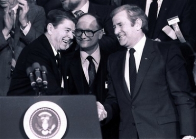 President Reagan shakes hands with The Rev. Jerry Falwell Sr., right, during a convention of National Religious Broadcasters in this Jan. 30, 1984, file photo in Washington, D.C. Falwell, the folksy, small-town preacher who used the power of television to found the Moral Majority and turn the Christian right into a mighty force in American politics during the Reagan years, died Tuesday, May 15, 2007. He was 73.